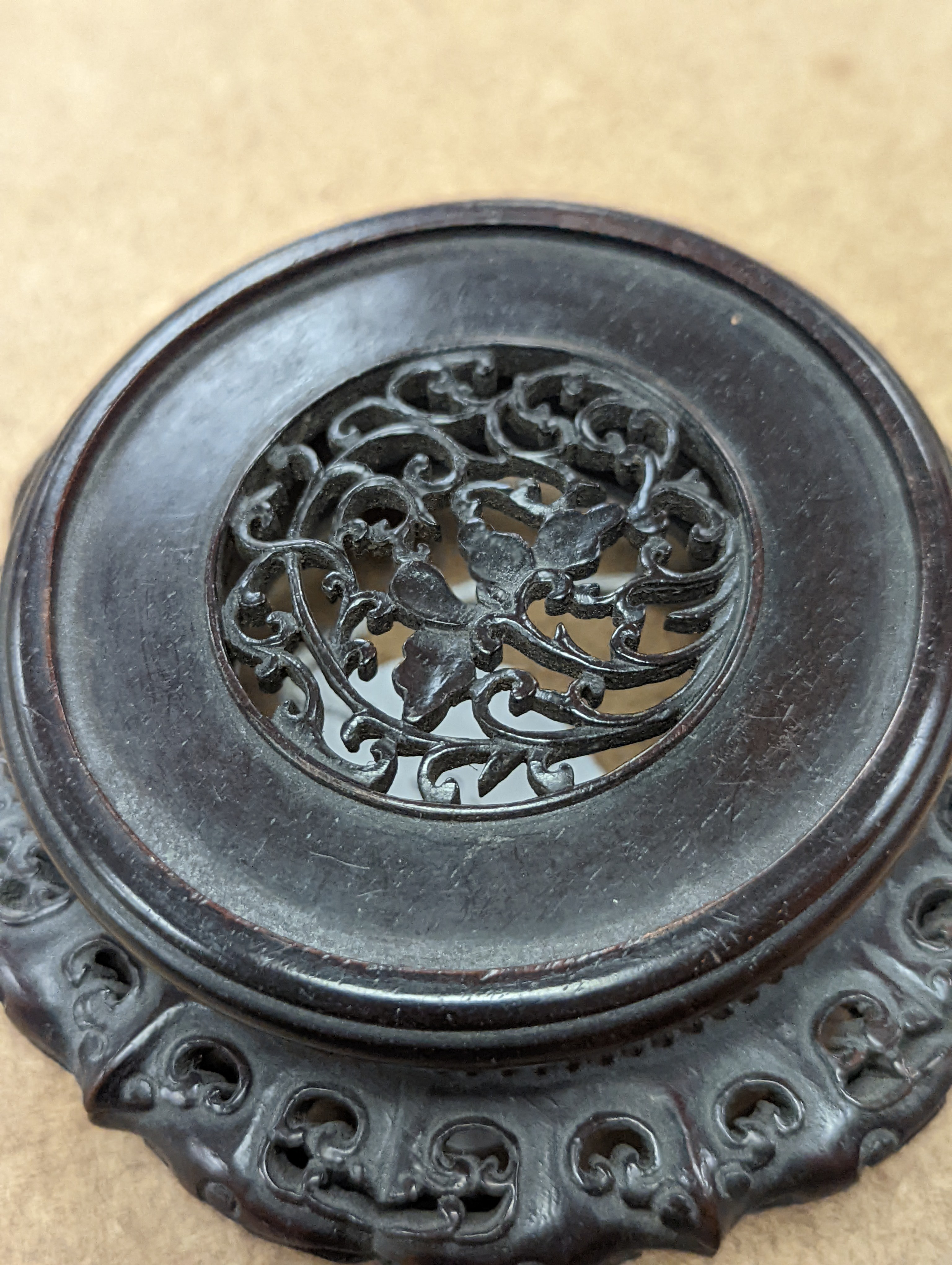 A fine 19th century Chinese hardwood stand, 11.4cm diameter